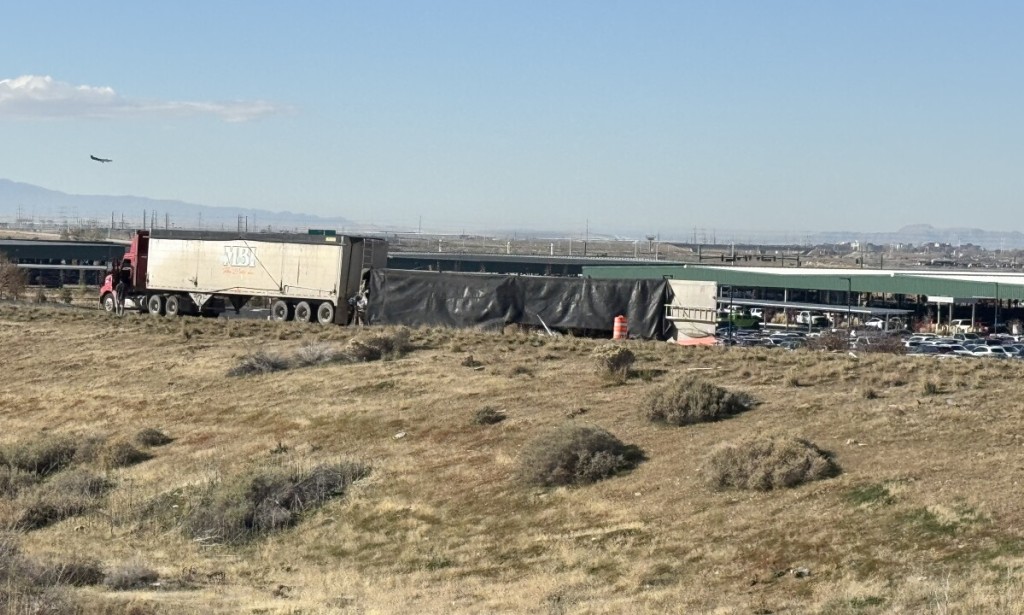 Semi hauling trash rolls on I-80 ramp, closing the road to traffic